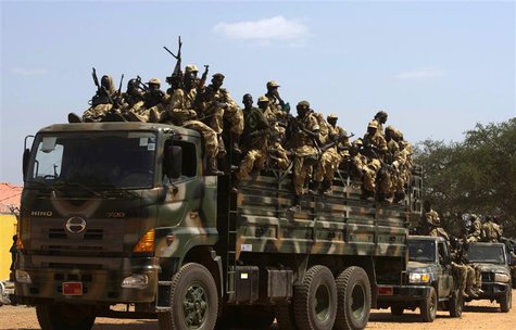 SPLA soldiers drive in a truck in Juba December 21, 2013. REUTERS/Stringer SPLA soldiers drive in a truck in Juba December 21, 2013. REUTERS/Stringer