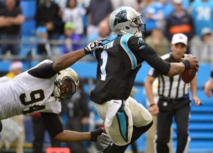 Dec 22, 2013; Charlotte, NC, USA; Carolina Panthers quarterback Cam Newton (1) is sacked by New Orleans Saints defensive end Cameron Jordan Dec 22, 2013; Charlotte, NC, USA; Carolina Panthers quarterback Cam Newton (1) is sacked by New Orleans Saints defensive end Cameron Jordan