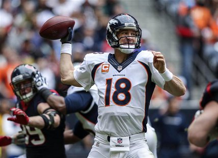 Dec 22, 2013; Houston, TX, USA; Denver Broncos quarterback Peyton Manning (18) attempts a pass during the second quarter against the Houston Dec 22, 2013; Houston, TX, USA; Denver Broncos quarterback Peyton Manning (18) attempts a pass during the second quarter against the Houston