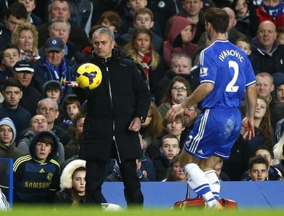 Chelsea manager Jose Mourinho pats the ball to Branislav Ivanovic during their English Premier League soccer match against Crystal Palace at Chelsea manager Jose Mourinho pats the ball to Branislav Ivanovic during their English Premier League soccer match against Crystal Palace at