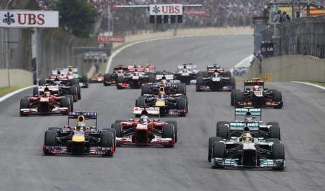 Mercedes Formula One driver Nico Rosberg of Germany (R, front) leads the pack as they head for the first turn at the start of the Brazilian Mercedes Formula One driver Nico Rosberg of Germany (R, front) leads the pack as they head for the first turn at the start of the Brazilian