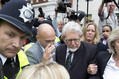 Entertainer Rolf Harris is surrounded by members of the media as he leaves Westminster Magistrates Court, in central London September 23, 20 Entertainer Rolf Harris is surrounded by members of the media as he leaves Westminster Magistrates Court, in central London September 23, 20