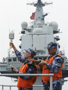 Chinese naval soldiers monitor meteorological indicators on the aircraft carrier "Liaoning", as they carry out training in South China Sea, Chinese naval soldiers monitor meteorological indicators on the aircraft carrier "Liaoning", as they carry out training in South China Sea,