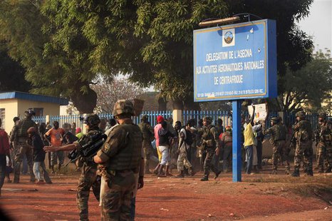 French military personnel try to control supporters who are asking them to disarm fighting gangs, near the airport in Bangui December 23, 20 French military personnel try to control supporters who are asking them to disarm fighting gangs, near the airport in Bangui December 23, 20