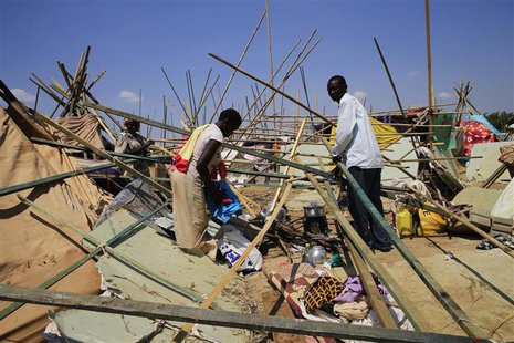 A displaced family from South Sudan's Nuer tribe, who fled their home in fear of ethnic killing by the Dinka-led government, erects a makesh A displaced family from South Sudan's Nuer tribe, who fled their home in fear of ethnic killing by the Dinka-led government, erects a makesh