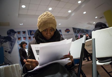 A woman fills out paperwork at a job training and resource fair at Coney Island in New York December 11, 2013. REUTERS/Eric Thayer A woman fills out paperwork at a job training and resource fair at Coney Island in New York December 11, 2013. REUTERS/Eric Thayer