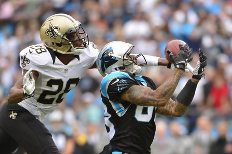 Dec 22, 2013; Charlotte, NC, USA; Carolina Panthers wide receiver Steve Smith (89) catches the ball as New Orleans Saints cornerback Keenan Dec 22, 2013; Charlotte, NC, USA; Carolina Panthers wide receiver Steve Smith (89) catches the ball as New Orleans Saints cornerback Keenan