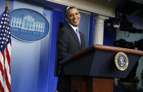 U.S. President Barack Obama reacts to a question during his year-end news conference in the White House briefing room in Washington, Decembe U.S. President Barack Obama reacts to a question during his year-end news conference in the White House briefing room in Washington, Decembe