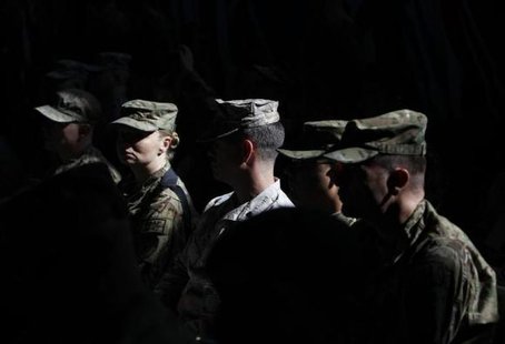 U.S. troops attend a change of command ceremony in Kabul February 10, 2013.
CREDIT: REUTERS/OMAR SOBHANI U.S. troops attend a change of command ceremony in Kabul February 10, 2013.
CREDIT: REUTERS/OMAR SOBHANI