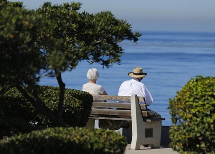 An elderly couple looks out at the ocean as they sit on a park bench in La Jolla, California November 13, 2013. REUTERS/Mike Blake An elderly couple looks out at the ocean as they sit on a park bench in La Jolla, California November 13, 2013. REUTERS/Mike Blake