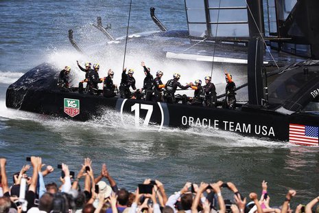 Members of Oracle Team USA wave to spectators after winning Race 16 of the 34th America's Cup yacht sailing race against Emirates Team New Z Members of Oracle Team USA wave to spectators after winning Race 16 of the 34th America's Cup yacht sailing race against Emirates Team New Z