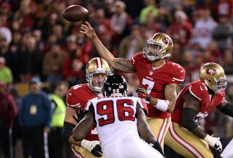 Dec 23, 2013; San Francisco, CA, USA; San Francisco 49ers quarterback Colin Kaepernick (7) passes the ball with pressure from Atlanta Falcon Dec 23, 2013; San Francisco, CA, USA; San Francisco 49ers quarterback Colin Kaepernick (7) passes the ball with pressure from Atlanta Falcon