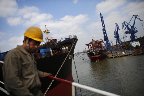 A labourer walks near a ship which is under construction at the Hudong-Zhonghua Shipbuilding company's shipyard in Shanghai October 14, 2013 A labourer walks near a ship which is under construction at the Hudong-Zhonghua Shipbuilding company's shipyard in Shanghai October 14, 2013
