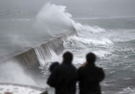 Waves crash over the breakwater of Saint Evette harbour at Esquibien in Brittany as an Atlantic storm hits western France, December 23, 2013 Waves crash over the breakwater of Saint Evette harbour at Esquibien in Brittany as an Atlantic storm hits western France, December 23, 2013