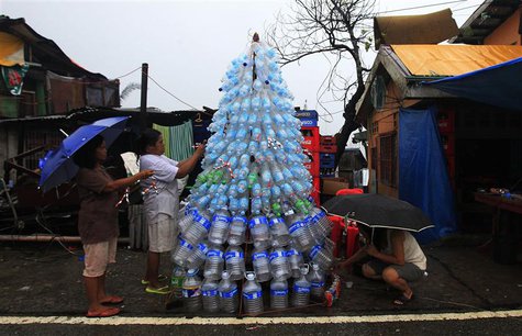 Victims of super Typhoon Haiyan decorate their improvised Christmas tree with empty cans and bottles at the ravaged town of Anibong, Tacloba Victims of super Typhoon Haiyan decorate their improvised Christmas tree with empty cans and bottles at the ravaged town of Anibong, Tacloba