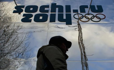 A man walks past a shop with an Olympic logo in the Black Sea resort town of Sochi December 21, 2013. REUTERS/Maxim Shemetov A man walks past a shop with an Olympic logo in the Black Sea resort town of Sochi December 21, 2013. REUTERS/Maxim Shemetov