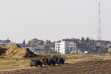 Israeli military jeeps are seen at the scene of a shooting incident near the border with the northern Gaza Strip, near kibbutz Nahal Oz Dece Israeli military jeeps are seen at the scene of a shooting incident near the border with the northern Gaza Strip, near kibbutz Nahal Oz Dece