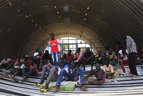 Families displaced by recent fighting in South Sudan, camp in a warehouse inside the United Nations Mission in Sudan (UNAMIS) facility in Ja Families displaced by recent fighting in South Sudan, camp in a warehouse inside the United Nations Mission in Sudan (UNAMIS) facility in Ja