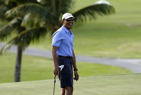 U.S. President Barack Obama smiles as he plays on the 18th hole during a round of golf at Mid Pacific Country Club in Kailua, Hawaii Decembe U.S. President Barack Obama smiles as he plays on the 18th hole during a round of golf at Mid Pacific Country Club in Kailua, Hawaii Decembe