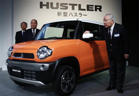 Suzuki Motor Corp Chairman and Chief Executive Officer Osamu Suzuki (R), Executive Vice President Minoru Tamura (C), and Executive Vice Pres Suzuki Motor Corp Chairman and Chief Executive Officer Osamu Suzuki (R), Executive Vice President Minoru Tamura (C), and Executive Vice Pres