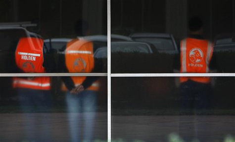 Workers wearing safety vests are seen through frosted windows at the General Motors Holden offices in Melbourne in this June 2, 2009 file ph Workers wearing safety vests are seen through frosted windows at the General Motors Holden offices in Melbourne in this June 2, 2009 file ph