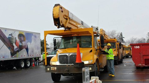 Consumers deployed trucks and stocks of material around the area so they would be able to respond quickly, when the wires started falling. (picture courtesy Consumers Energy} Consumers deployed trucks and stocks of material around the area so they would be able to respond quickly, when the wires started falling. (picture courtesy Consumers Energy}