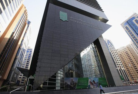 A man walks past a National Bank of Abu Dhabi branch, August 27, 2012. REUTERS/Jumana El Heloueh A man walks past a National Bank of Abu Dhabi branch, August 27, 2012. REUTERS/Jumana El Heloueh