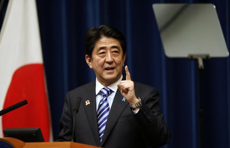 Japan's Prime Minister Shinzo Abe looks at a prompter as he speaks during a news conference to wrap up the ASEAN-Japan Commemorative Summit Japan's Prime Minister Shinzo Abe looks at a prompter as he speaks during a news conference to wrap up the ASEAN-Japan Commemorative Summit