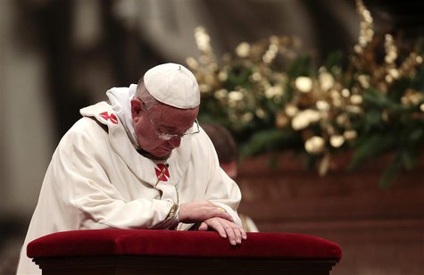 Pope Francis prays during the Christmas night mass in the Saint Peter's Basilica at the Vatican December 24, 2013. REUTERS/Tony Gentile Pope Francis prays during the Christmas night mass in the Saint Peter's Basilica at the Vatican December 24, 2013. REUTERS/Tony Gentile