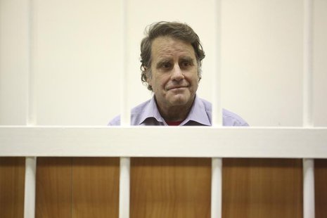 Peter Willcox, captain of the Greenpeace ship Arctic Sunrise, sits in the defendants' cage during a court hearing in St. Petersburg November Peter Willcox, captain of the Greenpeace ship Arctic Sunrise, sits in the defendants' cage during a court hearing in St. Petersburg November