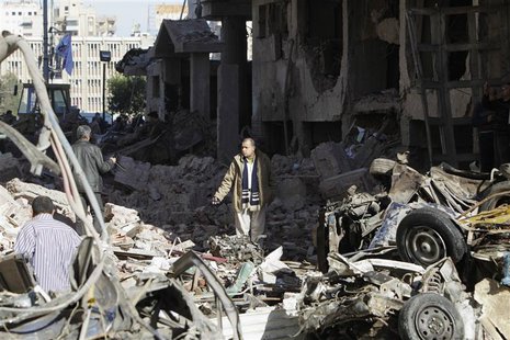 A man walks near debris after an explosion near a security building in Egypt's Nile Delta city of Mansoura in Dakahlyia province, about 120 A man walks near debris after an explosion near a security building in Egypt's Nile Delta city of Mansoura in Dakahlyia province, about 120