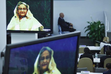 Delegates listen to Bangladesh's Prime Minister Sheikh Hasina (pictured on screens) while she addresses the 68th United Nations General Asse Delegates listen to Bangladesh's Prime Minister Sheikh Hasina (pictured on screens) while she addresses the 68th United Nations General Asse