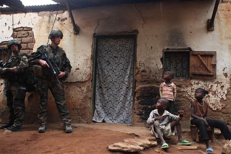 French soldiers conduct a daytime patrol in a neighbourhood in Bangui, where shooting continued overnight in the capital, December 26, 2013. French soldiers conduct a daytime patrol in a neighbourhood in Bangui, where shooting continued overnight in the capital, December 26, 2013.