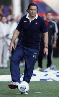 San Lorenzo's head coach Juan Antonio Pizzi kicks a ball during their Argentine First Division soccer match against Estudiantes in Buenos Ai San Lorenzo's head coach Juan Antonio Pizzi kicks a ball during their Argentine First Division soccer match against Estudiantes in Buenos Ai