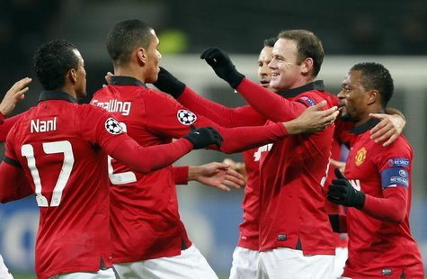 Manchester United's Nani, Chris Smalling, Ryan Giggs, Wayne Rooney and Patrice Evra (L-R) celebrate after Bayer Leverkusen's Emir Spahic sco Manchester United's Nani, Chris Smalling, Ryan Giggs, Wayne Rooney and Patrice Evra (L-R) celebrate after Bayer Leverkusen's Emir Spahic sco