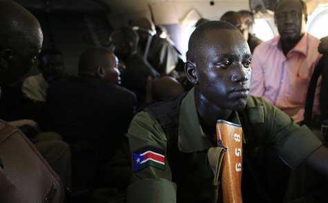 A South Sudan army soldier sweats as he holds his weapon during a flight from the capital Juba to Bor town, 180 km (108 miles) northwest fro A South Sudan army soldier sweats as he holds his weapon during a flight from the capital Juba to Bor town, 180 km (108 miles) northwest fro