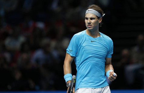 Rafael Nadal of Spain celebrates after winning the first set in a tie break during his men's singles tennis match against Stanislas Wawrinka Rafael Nadal of Spain celebrates after winning the first set in a tie break during his men's singles tennis match against Stanislas Wawrinka
