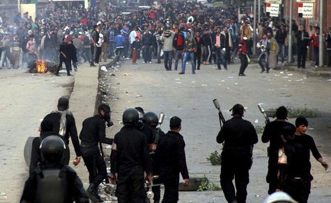 Supporters of the Muslim Brotherhood and ousted Egyptian President Mohamed Mursi run after riot police fired tear gas during clashes in Cair Supporters of the Muslim Brotherhood and ousted Egyptian President Mohamed Mursi run after riot police fired tear gas during clashes in Cair