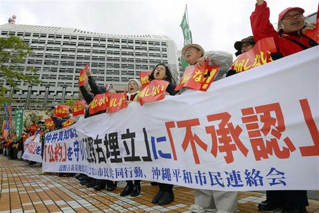 Protesters shout slogans during a rally against the relocation of a U.S. military base, in front of the Okinawa prefectural government offic Protesters shout slogans during a rally against the relocation of a U.S. military base, in front of the Okinawa prefectural government offic