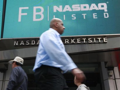 A man walks past a sign welcoming Facebook to the NASDAQ Marketsite in New York May 18, 2012. REUTERS/Brendan McDermid A man walks past a sign welcoming Facebook to the NASDAQ Marketsite in New York May 18, 2012. REUTERS/Brendan McDermid