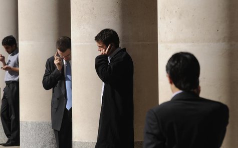 City workers make phone calls outside the London Stock Exchange in Paternoster Square in the City of London at lunchtime October 1, 2008. RE City workers make phone calls outside the London Stock Exchange in Paternoster Square in the City of London at lunchtime October 1, 2008. RE