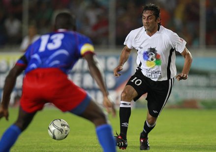 Veteran star Uruguay's Enzo Francescoli (R) challenges Haiti's Pierre Richard in a friendly soccer match between "Friends of Haiti" and Hait Veteran star Uruguay's Enzo Francescoli (R) challenges Haiti's Pierre Richard in a friendly soccer match between "Friends of Haiti" and Hait