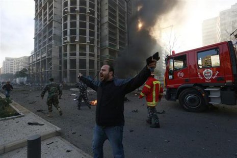 A security personnel shouts as smoke rises from the site of an explosion in Beirut's downtown area December 27, 2013. CREDIT: REUTERS/JAMAL SAIDI A security personnel shouts as smoke rises from the site of an explosion in Beirut's downtown area December 27, 2013. CREDIT: REUTERS/JAMAL SAIDI