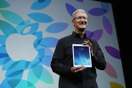 Apple Inc CEO Tim Cook holds up the new iPad Air during an Apple event in San Francisco, California October 22, 2013. REUTERS/Robert Galbrai Apple Inc CEO Tim Cook holds up the new iPad Air during an Apple event in San Francisco, California October 22, 2013. REUTERS/Robert Galbrai