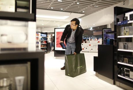 A man with a tablet computer stands in a Duty Free store at the Fraport airport in Frankfurt November 14, 2012. REUTERS/Lisi Niesner A man with a tablet computer stands in a Duty Free store at the Fraport airport in Frankfurt November 14, 2012. REUTERS/Lisi Niesner