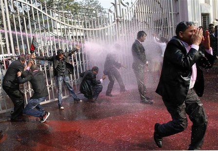 Lawyers loyal to Bangladesh Nationalist Party (BNP) and Bangladesh Jamaat-E-Islami shout slogans as policemen use water cannons during a pro Lawyers loyal to Bangladesh Nationalist Party (BNP) and Bangladesh Jamaat-E-Islami shout slogans as policemen use water cannons during a pro