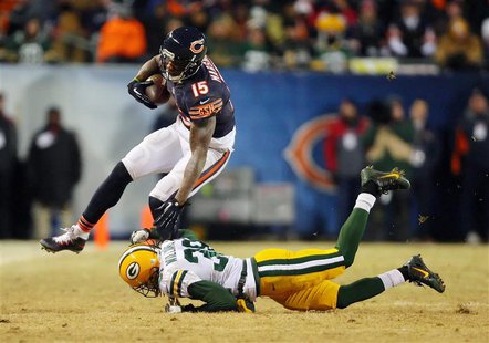 Dec 29, 2013; Chicago, IL, USA; Chicago Bears wide receiver Brandon Marshall (15) is tackled by Green Bay Packers cornerback Tramon Williams Dec 29, 2013; Chicago, IL, USA; Chicago Bears wide receiver Brandon Marshall (15) is tackled by Green Bay Packers cornerback Tramon Williams