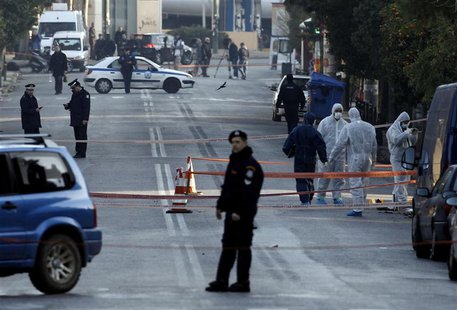 Police experts search for evidence following a gun attack, outside the German ambassador's residence in Chalandri suburb north of Athens Dec Police experts search for evidence following a gun attack, outside the German ambassador's residence in Chalandri suburb north of Athens Dec
