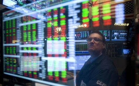 A trader is reflected in a screen as he works on the floor of the New York Stock exchange in New York, December 27, 2013. REUTERS/Carlo Alle A trader is reflected in a screen as he works on the floor of the New York Stock exchange in New York, December 27, 2013. REUTERS/Carlo Alle
