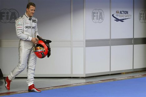Mercedes Formula One driver Michael Schumacher of Germany walks in parc ferme after the qualifying session of the Malaysian F1 Grand Prix at Mercedes Formula One driver Michael Schumacher of Germany walks in parc ferme after the qualifying session of the Malaysian F1 Grand Prix at